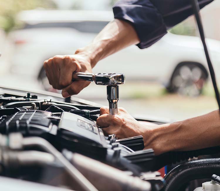 Mechanic repairing a truck engine, showcasing expertise in diesel engine maintenance in San Antonio, TX.