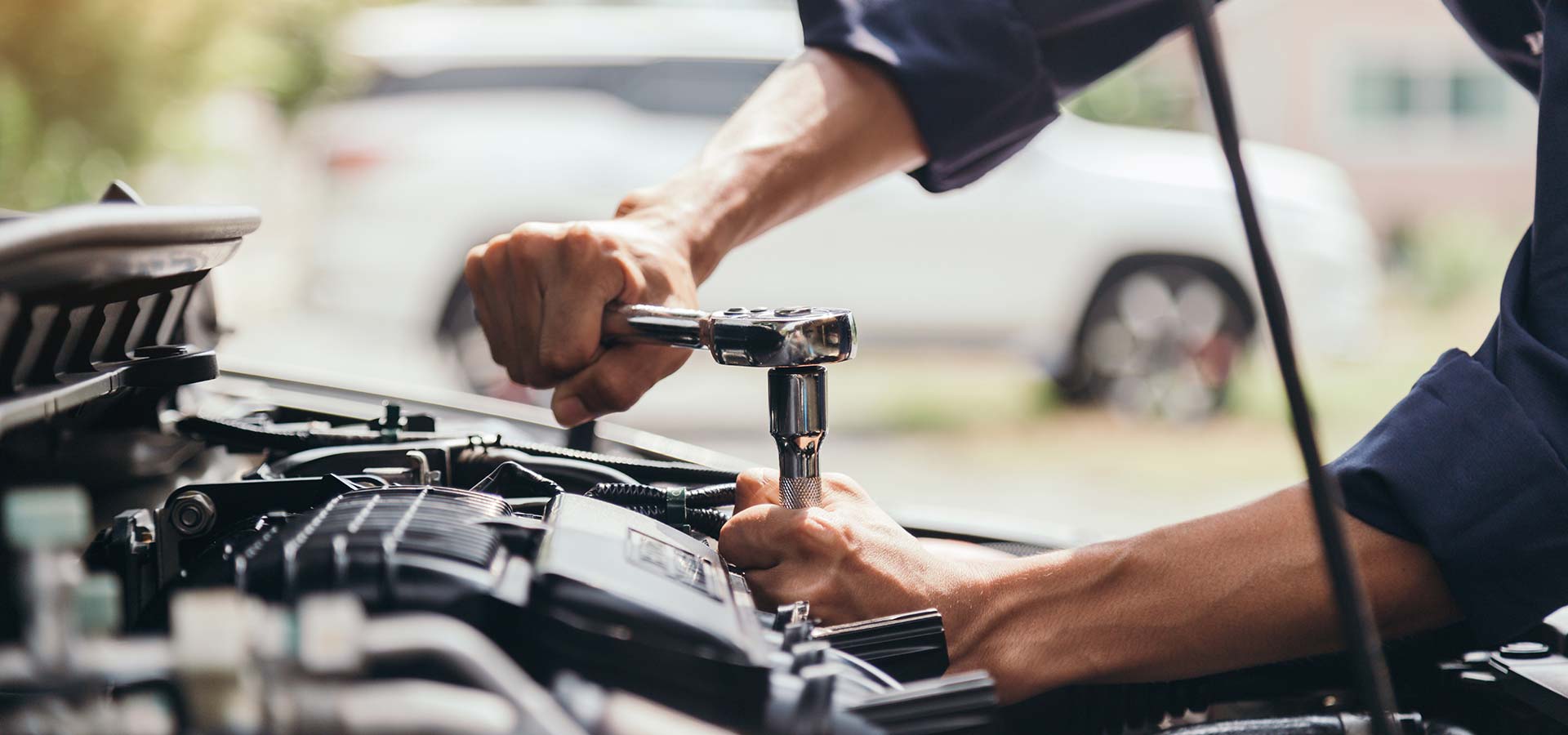 Mechanic repairing a truck engine, showcasing expertise in diesel engine maintenance in San Antonio, TX.